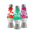 Three small squishy toys in the style of a Motion Lamp with metallic silver bases arranged side by side. From left to right, the lamps contain red and orange, green and blue, and purple and pink illuminating liquid globs.